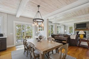 a dining room and living room with a table and chairs at Francis Lane in Stowe