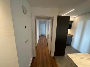 a hallway leading to a room with a kitchen and a hallway at Ederra By Basquelidays in Irún