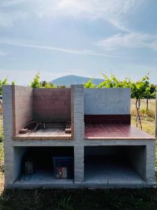 a building that is sitting in the grass at Agriturismo Graziano e Barbara in Porto Conte