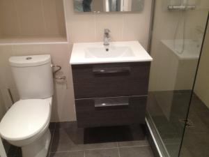 a bathroom with a toilet and a sink and a shower at Juana in Antibes