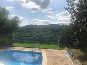a swimming pool with a view of the mountains at CHEZ LUCIEN in Trébas