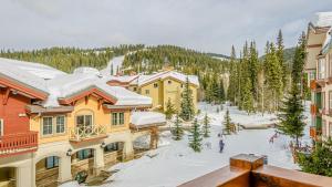 a view of a resort with snow covered buildings at Fireside Lodge #315 By Bear Country in Sun Peaks +17 photos