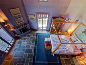 A bed or beds in a room at Tsagkarada Country Estate with Pool