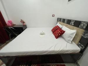 Rúm í herbergi á Govind Atithi Grah