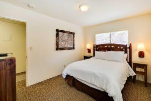 a bedroom with a large bed and a window at Ocean-View La Jolla Condo Rental with Covered Patio! in San Diego