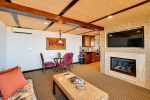 a living room with a fireplace and a tv at La Jolla Getaway with Patio and Ocean Views! in San Diego