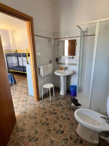 a bathroom with a sink and a toilet and a shower at Agriturismo Graziano e Barbara in Porto Conte +37 photos