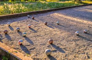a group of balls sitting on the ground at Villa Vercingétorix - groupe, Billard - Jacuzzi Spa in Romagnat