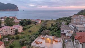 an aerial view of a city with the ocean at Apartments Bonazza in Petrovac na Moru