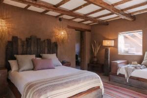 Ένα ή περισσότερα κρεβάτια σε δωμάτιο στο Our Habitas Atacama