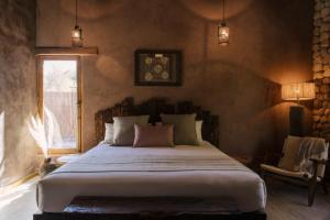 Ένα ή περισσότερα κρεβάτια σε δωμάτιο στο Our Habitas Atacama