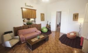 a living room with a couch and a table at Estancia Santa Elena in Villa Lía