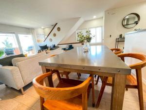 a kitchen and living room with a table and chairs at IB Seaside Paradise w/ Ocean Views! in Imperial Beach