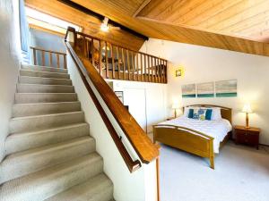 a bedroom with a staircase and a bed in it at IB Seaside Paradise w/ Ocean Views! in Imperial Beach