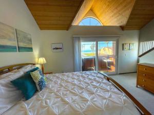 a bedroom with a large bed and a large window at IB Seaside Paradise w/ Ocean Views! in Imperial Beach