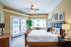 a bedroom with a bed and a ceiling fan at Convenient Gatlinburg Condo in Gatlinburg
