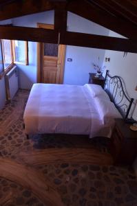 Postel nebo postele na pokoji v ubytování B&B Da Giua'