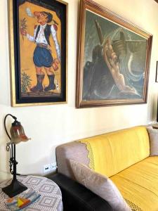 a living room with two framed pictures on the wall at Villa Rahati in Kroústas