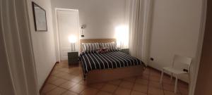 Posteľ alebo postele v izbe v ubytovaní Palazzo Altavilla Deluxe