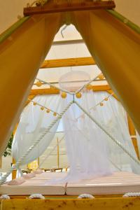 a close up of a bed in a tent at Camping Tents with Garden Hanging Bed in Porto Rafti