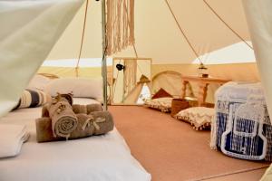 a room with two beds in a tent at Camping Tents with Garden Hanging Bed in Porto Rafti