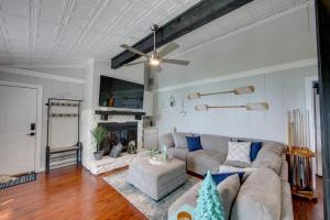 a living room with a couch and a fireplace at Home On Lake Bob Sandlin with Private Boat Dock! in Pittsburg