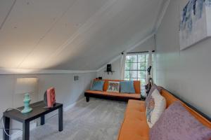 a living room with a couch and a table at Home On Lake Bob Sandlin with Private Boat Dock! in Pittsburg