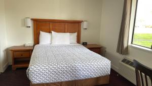 Postel nebo postele na pokoji v ubytování Morgan Inn and Suites Walla Walla