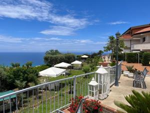 a balcony with a view of the ocean at Villa Del Conte in Drapia