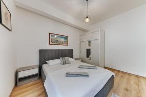 Кровать или кровати в номере Terra Lux Residences