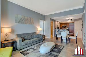 a living room with a couch and a table at MGM Signature-32-621 1Br2Ba F1 Strip View Balcony in Las Vegas