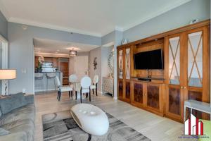 a living room with a couch and a dining room at MGM Signature-32-621 1Br2Ba F1 Strip View Balcony in Las Vegas