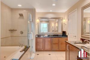 a bathroom with a tub and a shower and a sink at MGM Signature-32-621 1Br2Ba F1 Strip View Balcony in Las Vegas