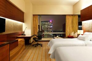 Postel nebo postele na pokoji v ubytování The Westin Guangzhou