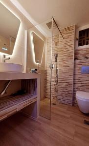 a bathroom with a shower and a sink and a toilet at Blue Horizon Gem On The Port in Rafina
