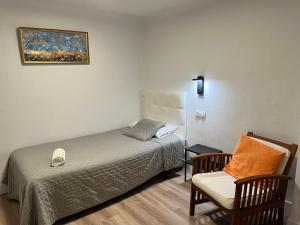 Posteľ alebo postele v izbe v ubytovaní Hostal ARS