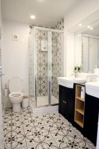 a bathroom with a shower and a toilet and a sink at Ocean View apartment, beautiful sea views in Kent