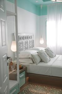 Posteľ alebo postele v izbe v ubytovaní Flora Apartments & Studios