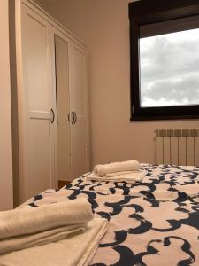 En eller flere senge i et værelse på Apartman Luni