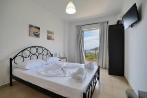 Postel nebo postele na pokoji v ubytování Nefelis Rooms
