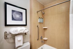 a bathroom with a shower and a toilet at Residence Inn by Marriott Houston I-10 West/Park Row in Houston