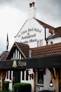 a white building with a sign on top of it at Ye Olde Bell Hotel & Spa in Retford