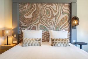 Postel nebo postele na pokoji v ubytování Leonardo Hotel Breda City Center