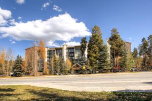 an empty street in front of a large building at RECENTLY UPDATED Ski In & Out Condo with Heated Garage Parking and VIEWS! TE303 in Breckenridge