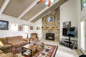 a living room with a couch and a fireplace at Gatlinburg Home Mountain Views and Indoor Hot Tub! in Gatlinburg