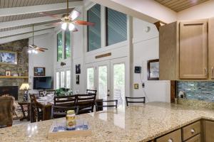 an open kitchen and dining room with a dining table at Gatlinburg Home Mountain Views and Indoor Hot Tub! in Gatlinburg
