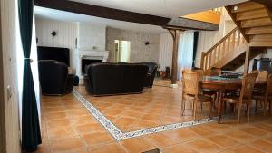 a dining room with a table and chairs at Bois de Crâne in Landes-le-Gaulois +46 photos