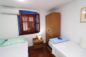 Postel nebo postele na pokoji v ubytování Fancy Apartments Marco