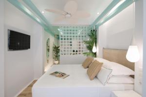 Posteľ alebo postele v izbe v ubytovaní Flora Apartments & Studios