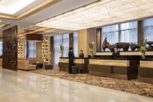 a rendering of the lobby of a hotel at Courtyard by Marriott Suzhou in Suzhou +38 photos